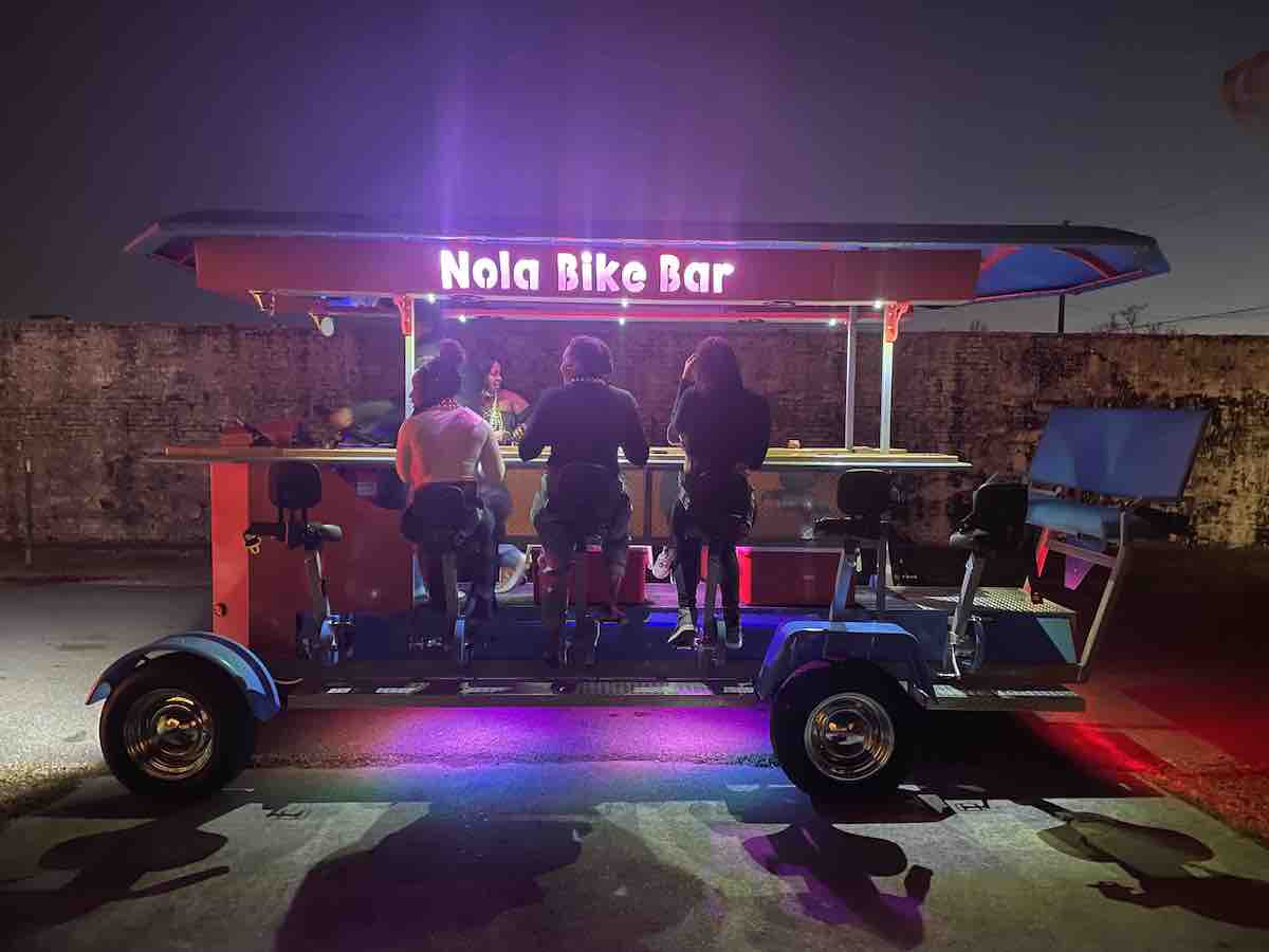 a group of people standing in front of a truck
